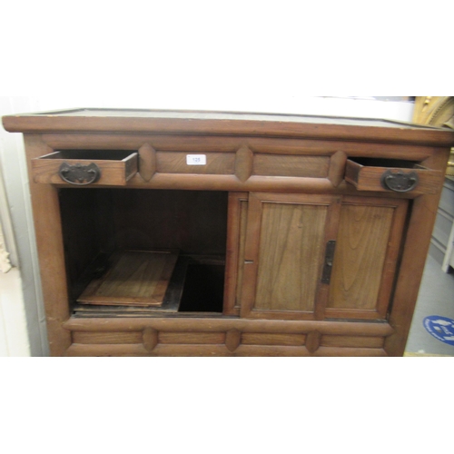 125 - A 20thC Chinese fruitwood cabinet, comprising an arrangement of two drawers and four doors, on block... 