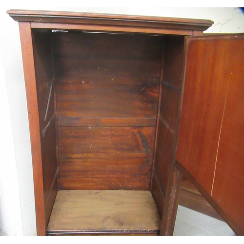 131 - A late Victorian walnut music cabinet with a mirrored and glazed door, raised on square legs  3... 