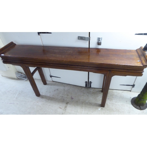 148 - A modern Chinese design, hardwood alter table, raised on tapered legs  36