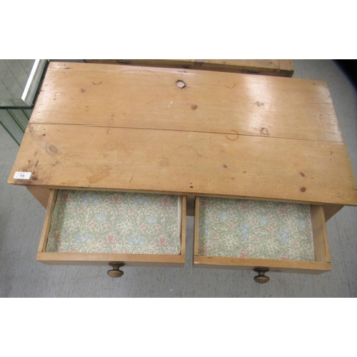 15 - An early 20thC waxed pine side table, the planked top over two inline drawers, raised on ring turned... 