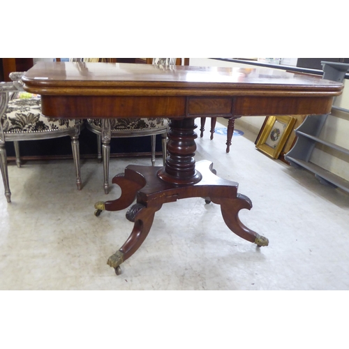 163 - An early/mid 19thC mahogany tea table, the rotating foldover top raised on quadruped base, splayed f... 