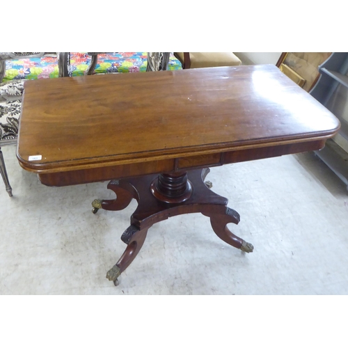 163 - An early/mid 19thC mahogany tea table, the rotating foldover top raised on quadruped base, splayed f... 