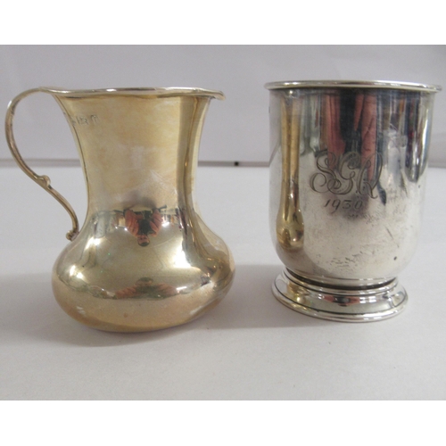 175 - A silver beaker; and a silver cream jug  mixed marks