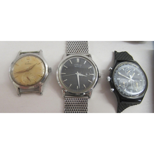 176 - A Ronson stainless steel cigarette lighter  boxed; and four various gentlemen's wristwatches: to inc... 