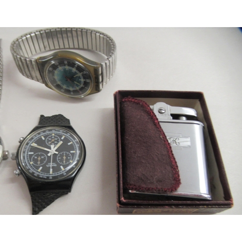 176 - A Ronson stainless steel cigarette lighter  boxed; and four various gentlemen's wristwatches: to inc... 