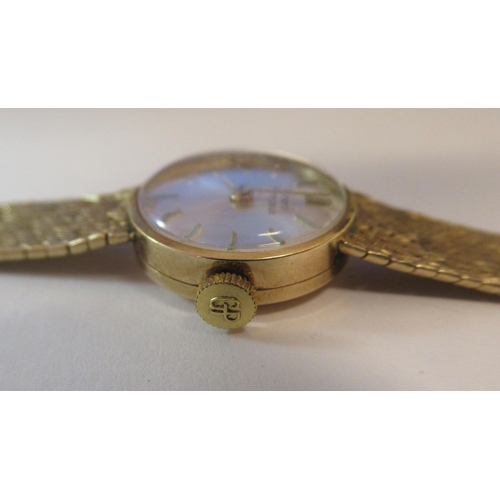 178 - A lady's Girard Perregaux 9ct gold cased and strapped wristwatch, faced by a baton dial