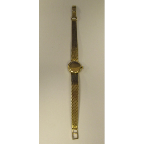 178 - A lady's Girard Perregaux 9ct gold cased and strapped wristwatch, faced by a baton dial