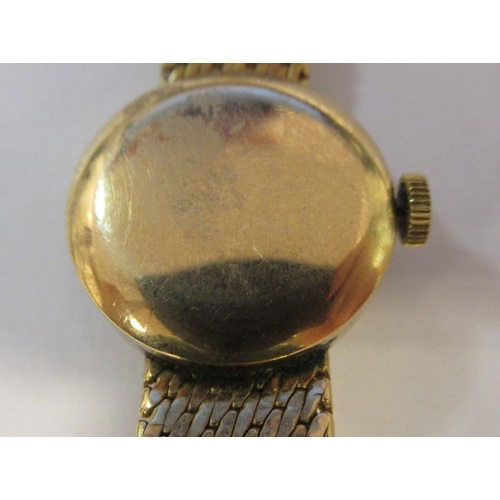 178 - A lady's Girard Perregaux 9ct gold cased and strapped wristwatch, faced by a baton dial