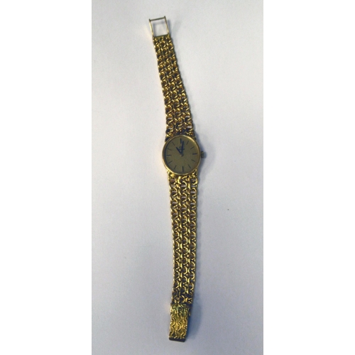 180 - A lady's Omega 18ct gold cased and strapped wristwatch, faced with a stick and baton dial