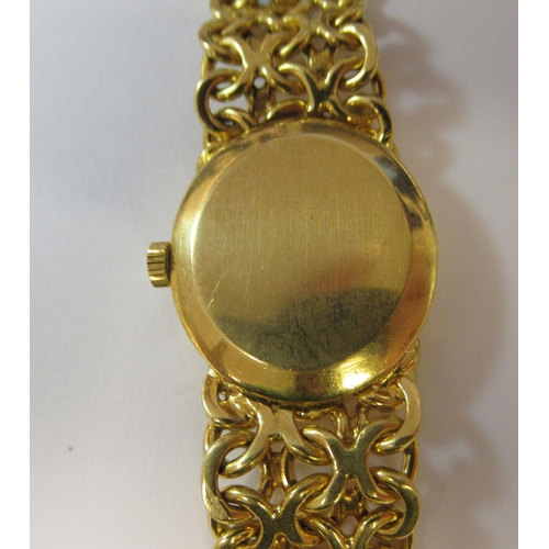 180 - A lady's Omega 18ct gold cased and strapped wristwatch, faced with a stick and baton dial