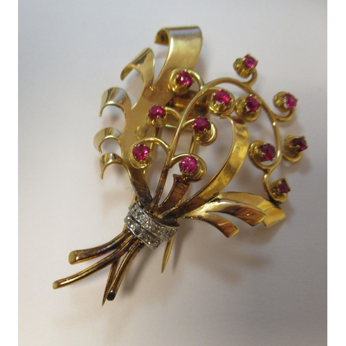 185 - A yellow metal brooch, shaped as a bouquet, set with rubies and diamonds