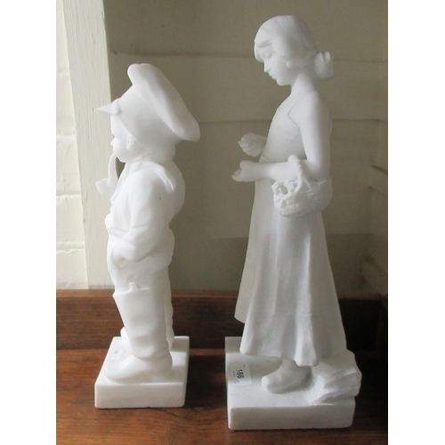 186 - Two composition marble figures, viz. a boy smoking a pipe  15