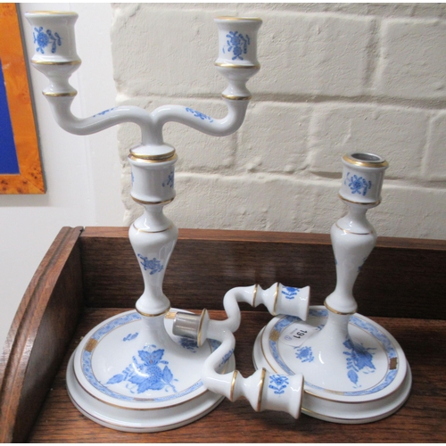 191 - A pair of Herend porcelain two branch candlesticks, decorated with blue floral sprigs  10.5