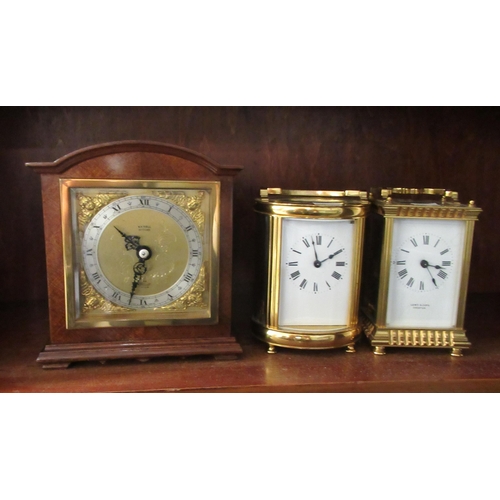 196 - Clocks: to include a carriage timepiece with a lacquered brass case and glass panels  4.5