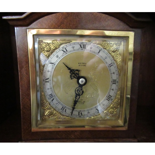 196 - Clocks: to include a carriage timepiece with a lacquered brass case and glass panels  4.5