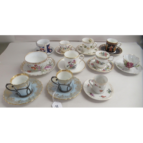 204 - Cabinet cups and saucers: to include a pair of Edwardian Aynsley coffee cans and saucers with silver... 