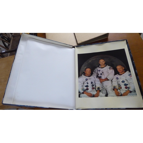 206 - An Omega souvenir gift box, commemorating the 1969 Moon Landing, containing photographic prints