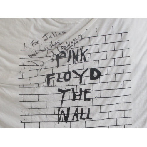 21 - A Pink Floyd framed tribute  comprising a T-shirt bearing a David Gilmour signature; two drumsticks ... 