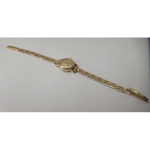 217 - A lady's Omega gold plated, stainless steel cased Omega wristwatch, on a 9ct gold gate link strap wi... 