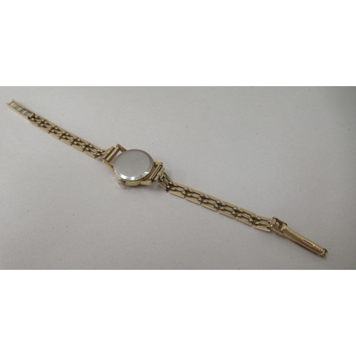 217 - A lady's Omega gold plated, stainless steel cased Omega wristwatch, on a 9ct gold gate link strap wi... 