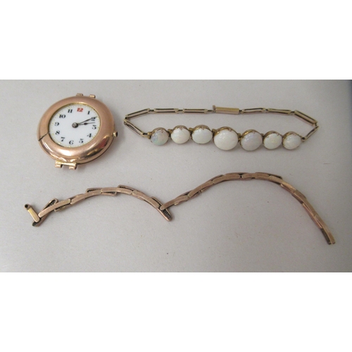 218 - A 9ct gold cased and strapped (broken) wristwatch, faced by an Arabic dial; and a (possibly) Contine... 