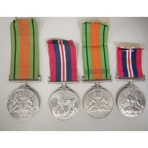 235 - Four Second World War King George VI Defence medals with ribbons(Please Note: this lot is subject to... 