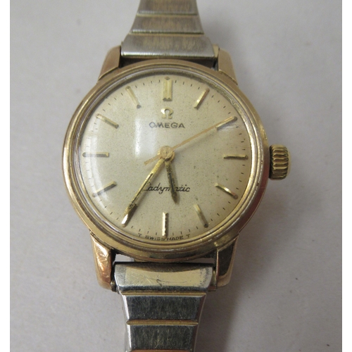 238 - A lady's Omega 9ct gold cased automatic wristwatch, faced by a baton dial, with an Omega box