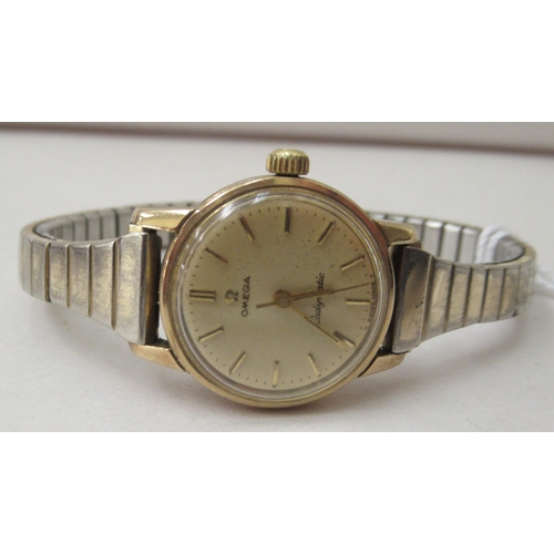 238 - A lady's Omega 9ct gold cased automatic wristwatch, faced by a baton dial, with an Omega box