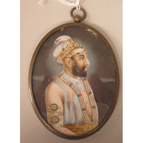 241 - A late 19thC oval half length portrait miniature, a bearded man wearing Persian costume with adornme... 