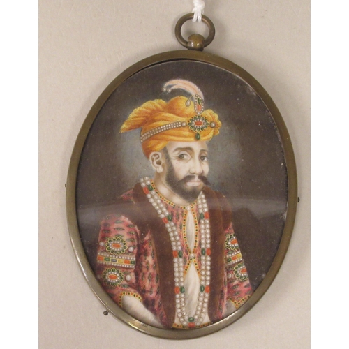 242 - A late 19thC oval half length portrait miniature, a bearded man wearing Persian costume with adornme... 