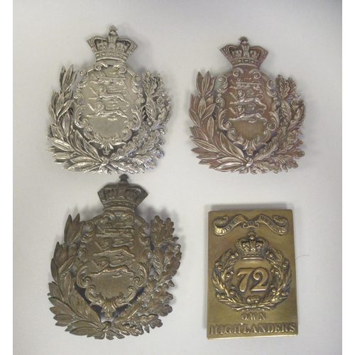 243 - A 72nd Duke of Albany's Own Highlander's brass shoulder belt device; and three similar Hampshire Reg... 