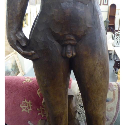 281 - A carved and stained wood statue, a standing male nude  36