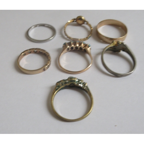 29 - Seven rings: to include a gold coloured example, set with five turquoise beads; and a 9ct gold weddi... 