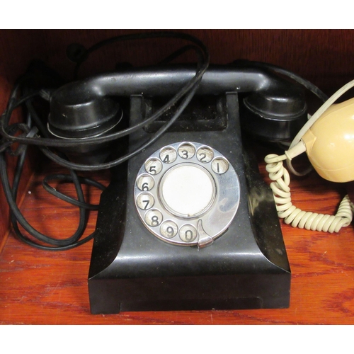 294 - Three dissimilar telephone handsets: to include an early 20thC wall mounted example with a dial-up m... 