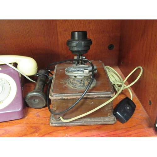 294 - Three dissimilar telephone handsets: to include an early 20thC wall mounted example with a dial-up m... 