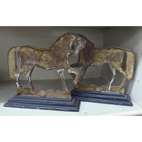 300 - Decorative brassware: to include a pair of early 20thC prancing horse door porters  10