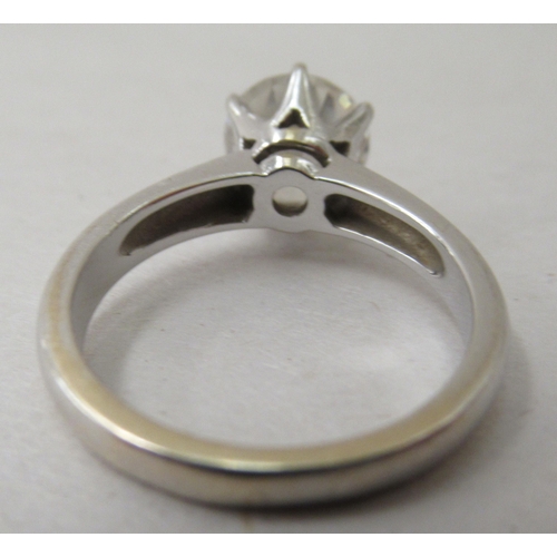 305 - An 18ct white gold solitaire ring, set with a white stone