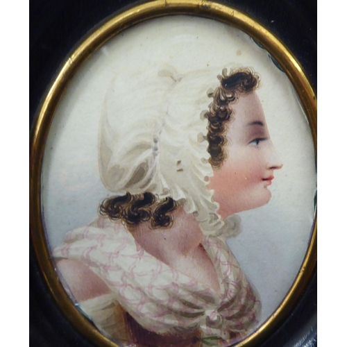 314 - A late 19thC oval head and shoulders profile portrait, a young woman wearing a bonnet  3.5