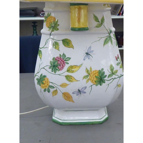 334 - An Italian fiance, vase design lamp base, decorated in colours with trailing flora and insects  26