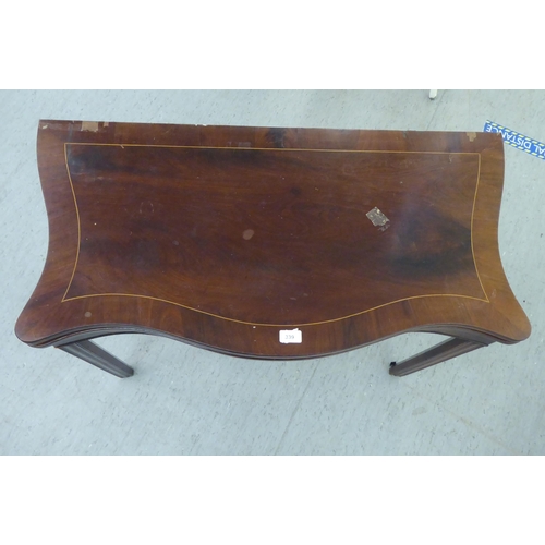 339 - A Regency mahogany serpentine front, foldover card table, raised on chamfered square legs  29