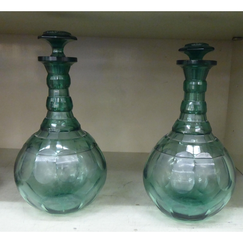 352 - A pair of late 19thC tinted green glass bulbous decanters with stoppers; and a pair of 20thC Portugu... 