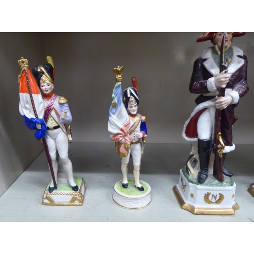 355 - Five 20thC Continental porcelain models, depicting 18th/19thC military figures, one mounted  9