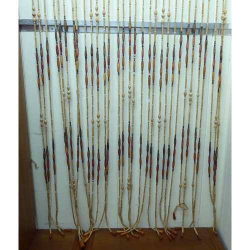 363 - A 1980s bead strung door entrance fly curtain