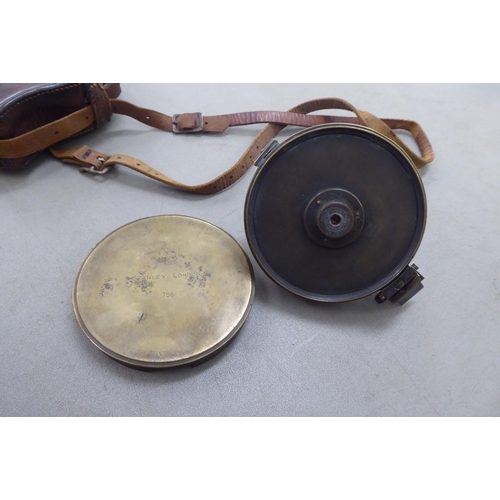 372 - A Great War period brass and glazed compass, in a stitched hide carrying case