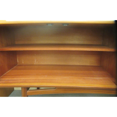 38 - A G-Plan teak sideboard, comprising a pair of cupboard doors, an adjacent bank of four drawers and a... 