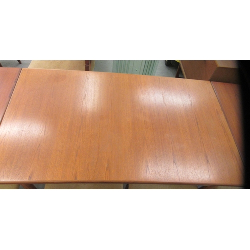 39 - A G-Plan teak draw leaf dining table, raised on turned, tapered legs  28.5