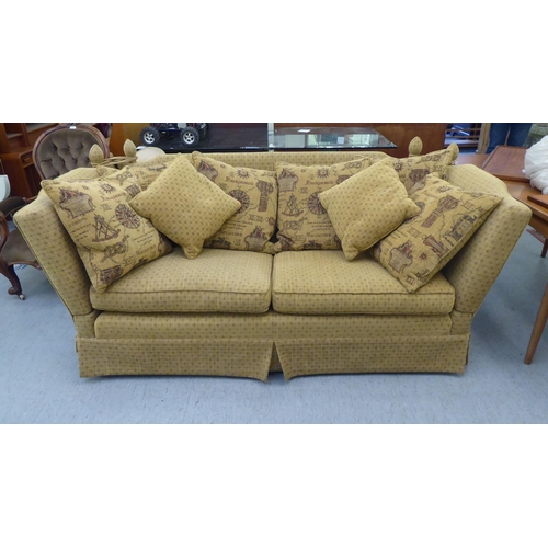 405 - A modern three person, drop-end settee, upholstered in a biscuit coloured fabric, on casters  78