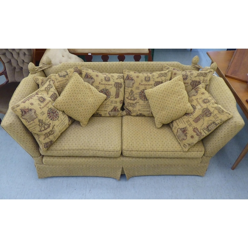 405 - A modern three person, drop-end settee, upholstered in a biscuit coloured fabric, on casters  78