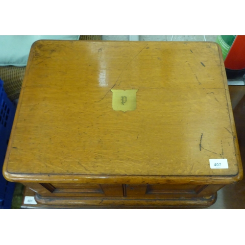 407 - A late Victorian oak canteen box with two doors, enclosing three drawers  11