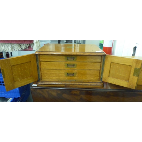 407 - A late Victorian oak canteen box with two doors, enclosing three drawers  11